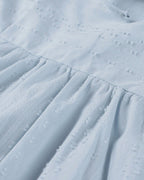 ER | Miniabito dalla linea ariosa con scollo a V, maniche a 3/4 e tasche