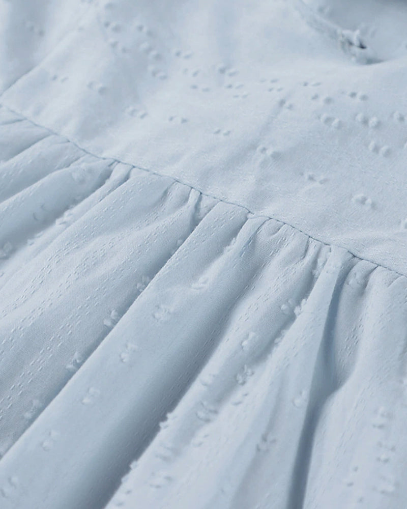 ER | Miniabito dalla linea ariosa con scollo a V, maniche a 3/4 e tasche