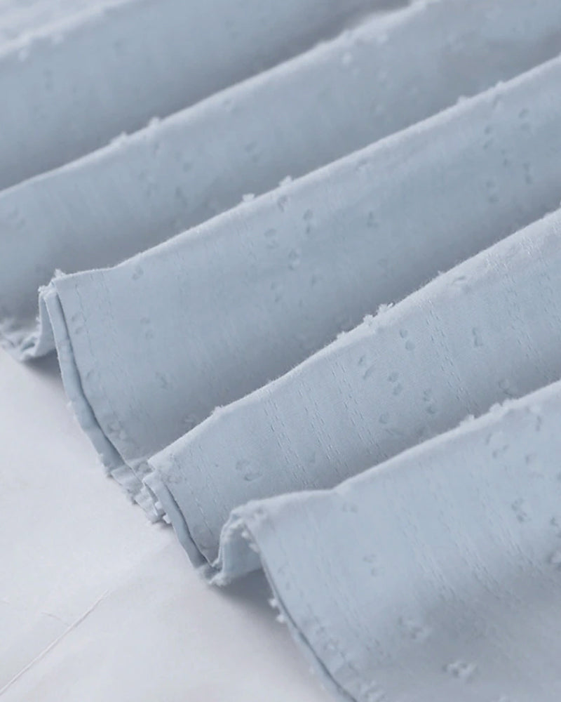 ER | Miniabito dalla linea ariosa con scollo a V, maniche a 3/4 e tasche